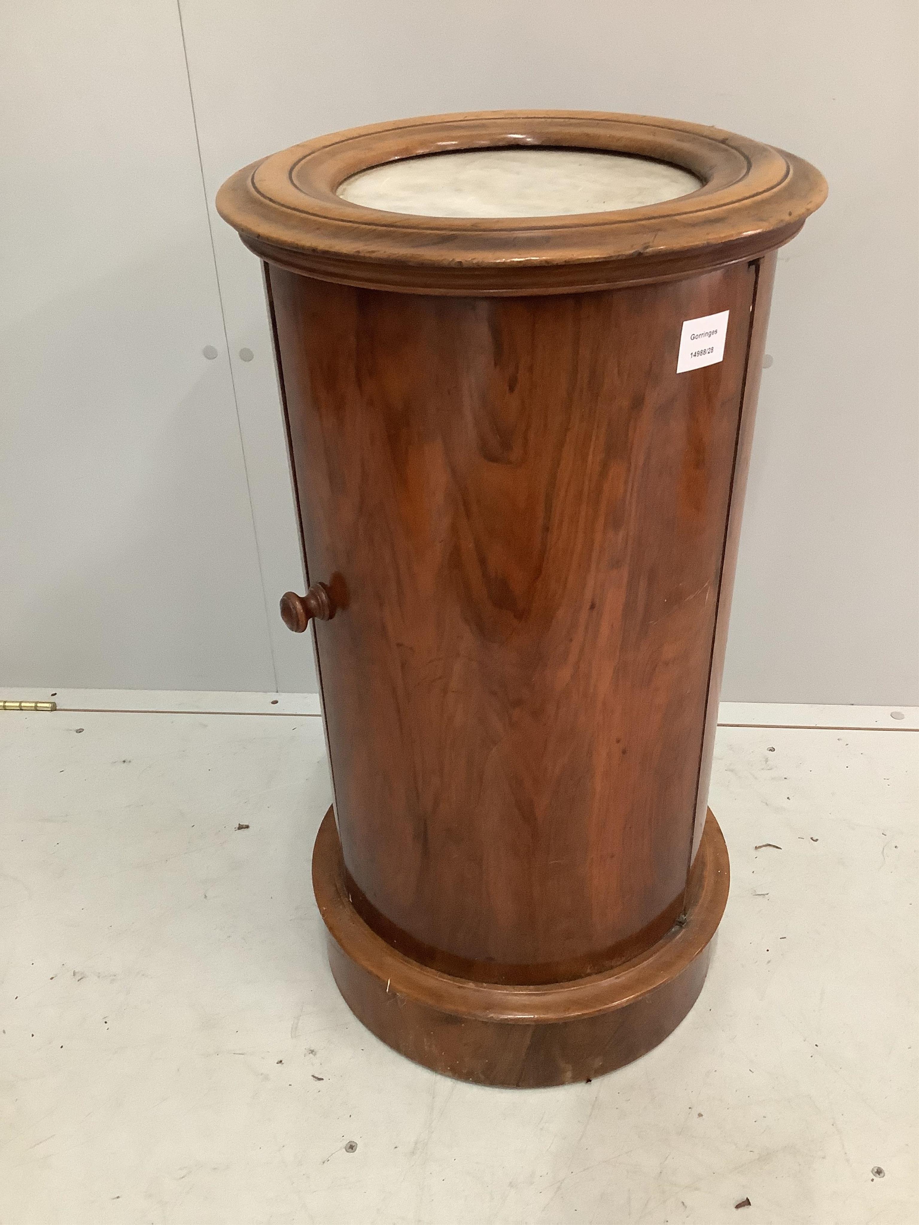 A Victorian walnut cylindrical bedside cabinet with a white marble inset top, diameter 40cm, height 75cm. Condition - fair